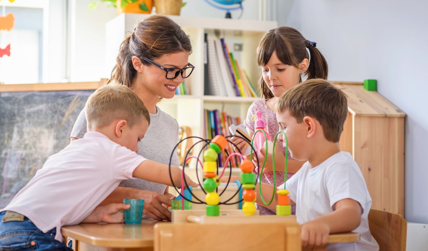 Children engaging in hands-on play-based learning activities at Little Nestlings Preschool