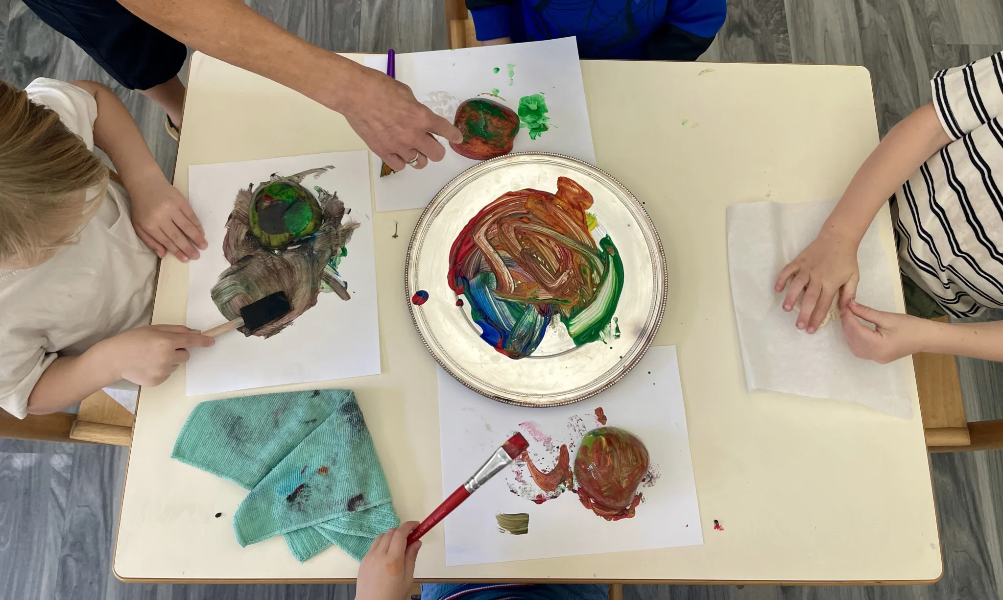 Children creating colorful artwork during preschool activities